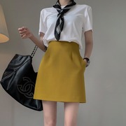 黄色高腰a字半身裙女春秋2023设计感小众休闲西装包臀短裙子