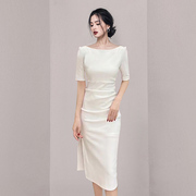 白色中袖连衣裙女收腰春法式高级感赫本风小众设计一字肩长裙