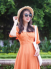 去云南西藏新疆女装旅拍橙色收腰沙滩裙露背开叉大裙摆连衣裙长款