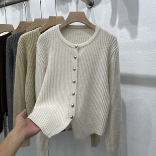 设计感下摆不规则圆领单排扣针织开衫女秋季纯色长袖毛衣外套