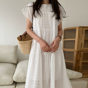 法式温柔白色连衣裙女夏季甜美风花型，镂空花瓣袖宽松休闲纯色长裙